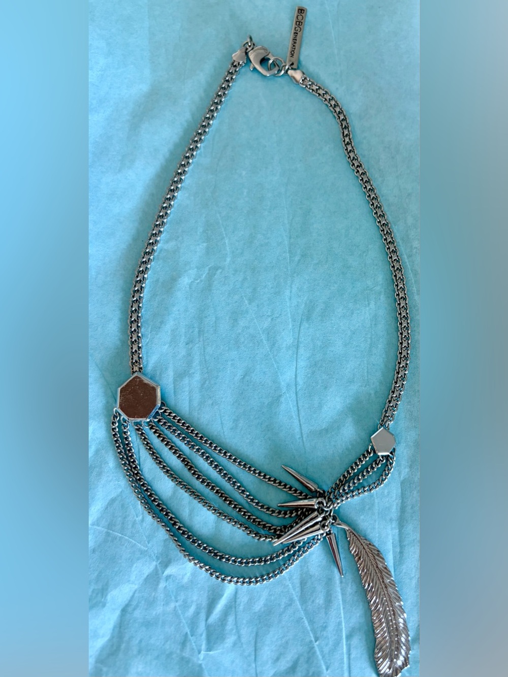 BCBG  Silver Multi-Chain Necklace with Geometric Fringe & feather Charms